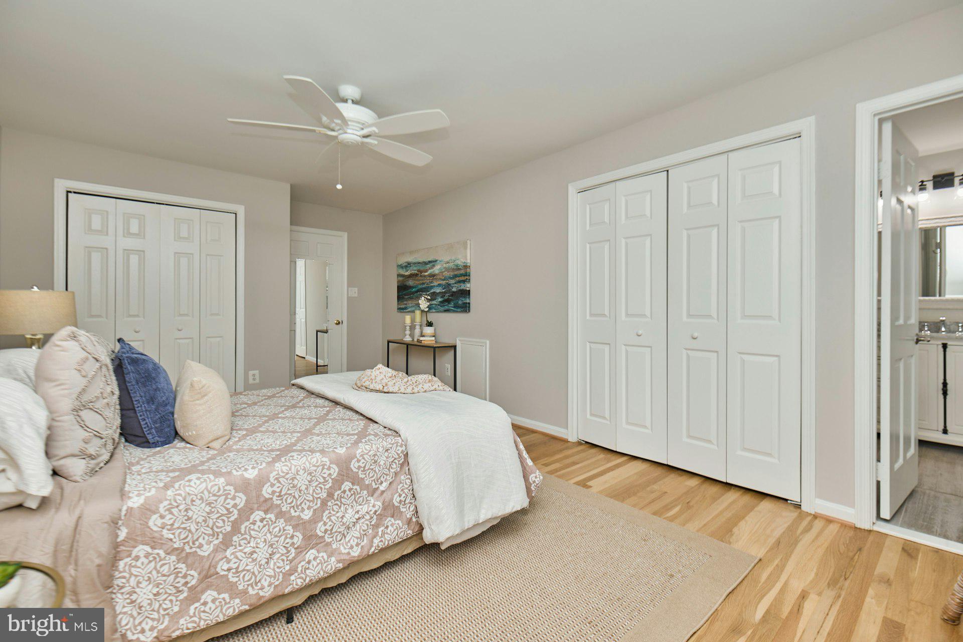 1120 Kensington Road McLean, VA 22101 - Photo 20 of 47 a bedroom with a large bed and a chandelier