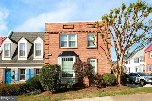 a front view of a building with garden