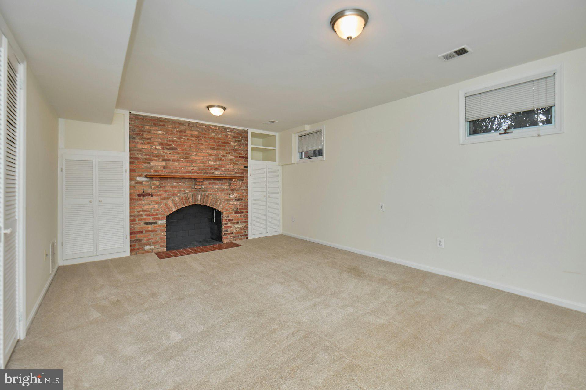 1120 Kensington Road McLean, VA 22101 - Photo 27 of 47 a view of an empty room with a fireplace