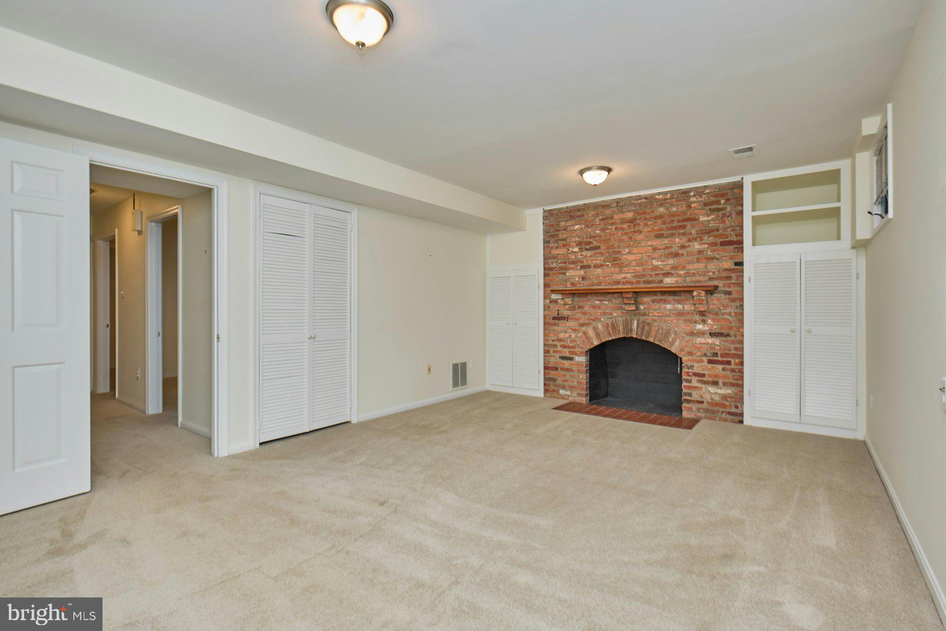 1120 Kensington Road McLean, VA 22101 - Photo 28 of 47 a view of an empty room with a fireplace