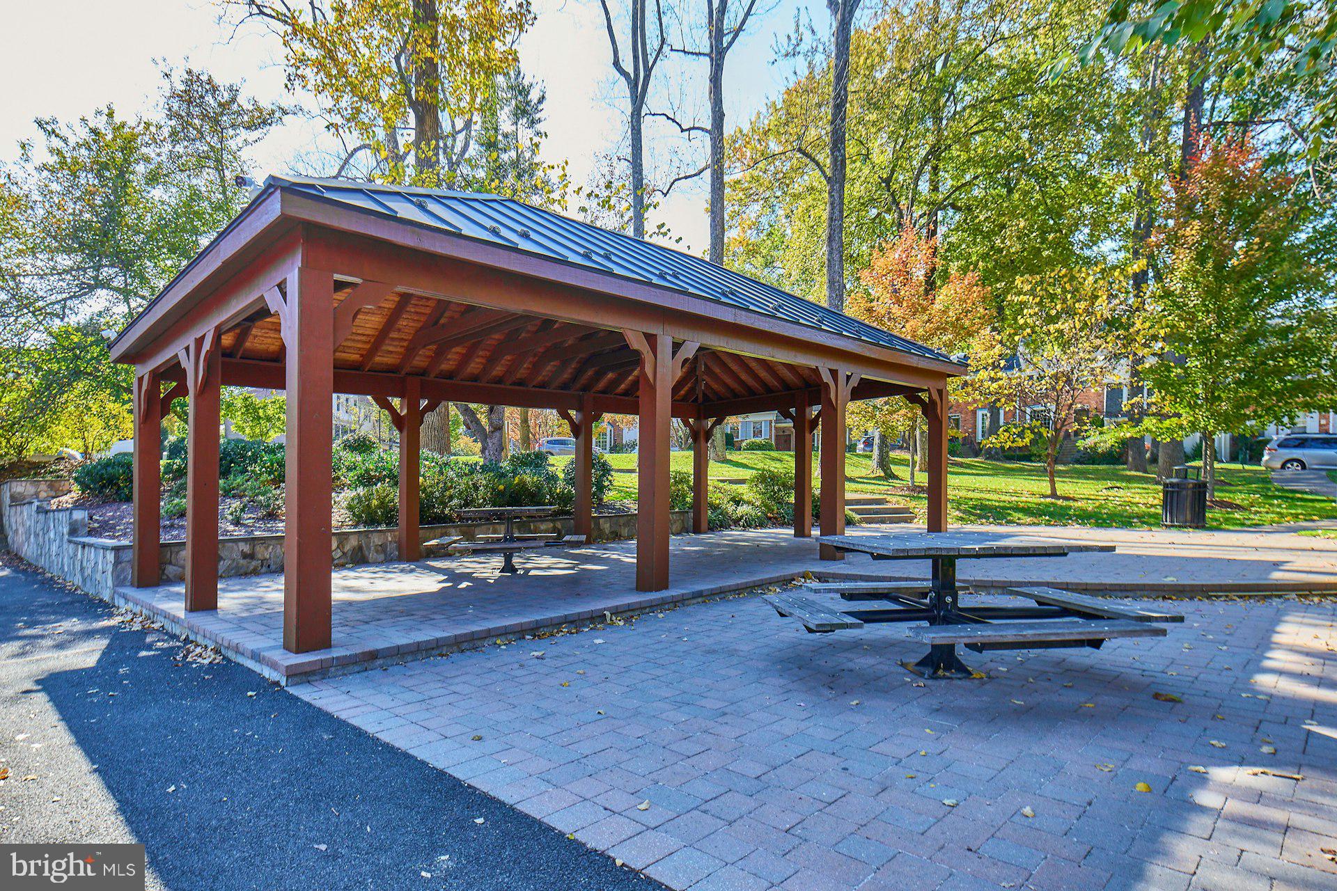 1120 Kensington Road McLean, VA 22101 - Photo 43 of 47 a backyard of a house with table and chairs