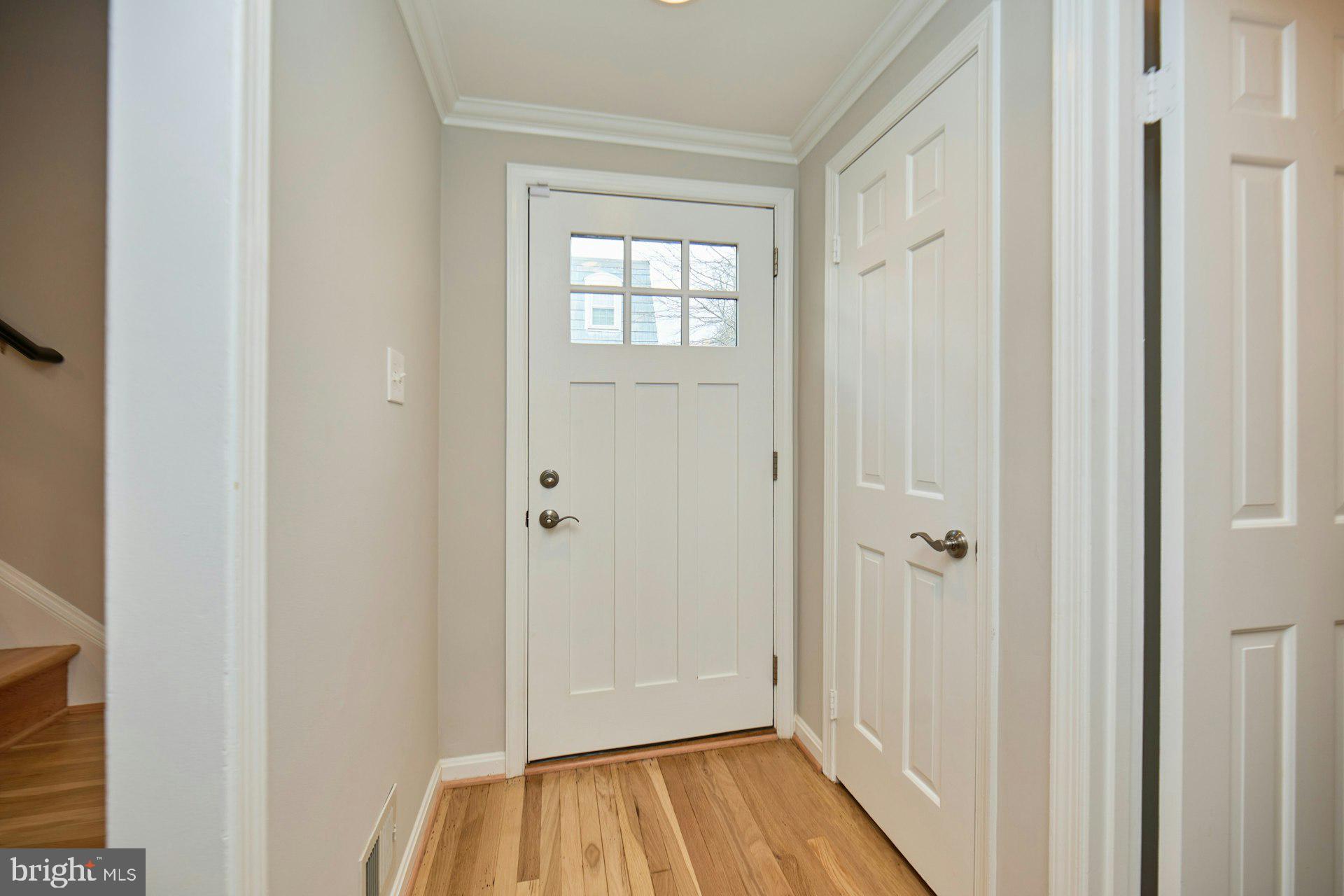 1120 Kensington Road McLean, VA 22101 - Photo 5 of 47 a view of a hallway with wooden floor and closet area