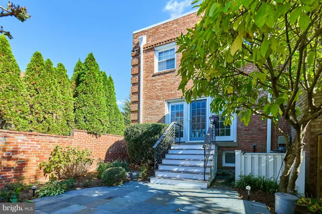 a view of a house with a flower garden