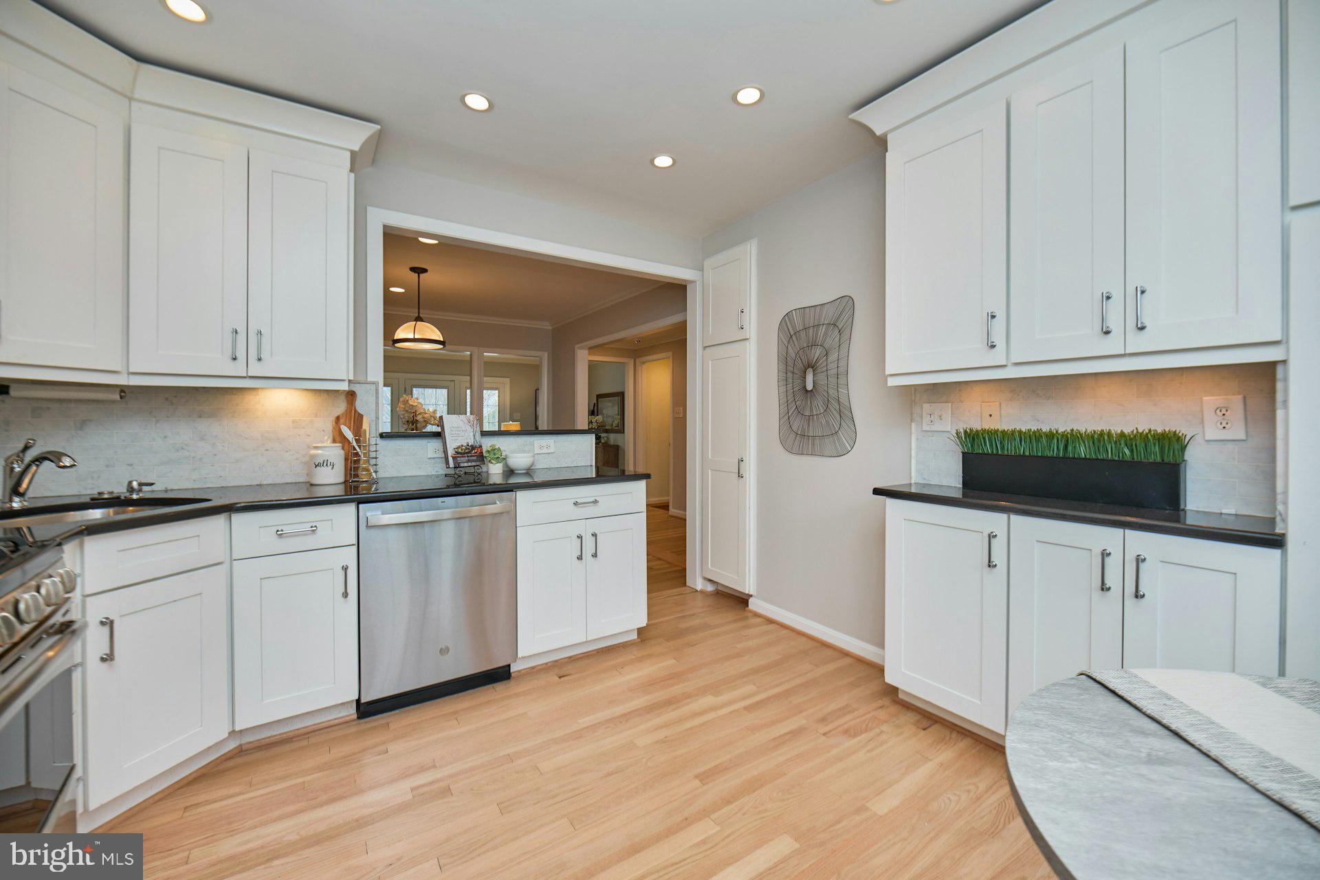 1120 Kensington Road McLean, VA 22101 - Photo 10 of 47 a kitchen with white cabinets and sink