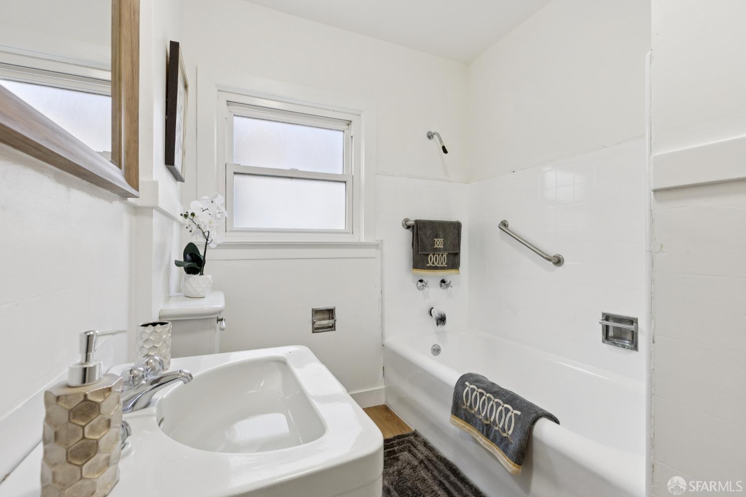 1316 Castillo Avenue Burlingame, CA 94010 - Photo 15 of 33 a bathroom with a sink a toilet and shower