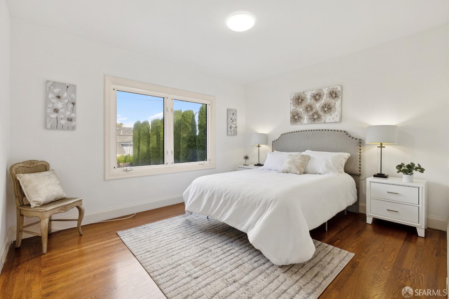 1316 Castillo Avenue Burlingame, CA 94010 - Photo 16 of 33 a bedroom with a bed and a chair