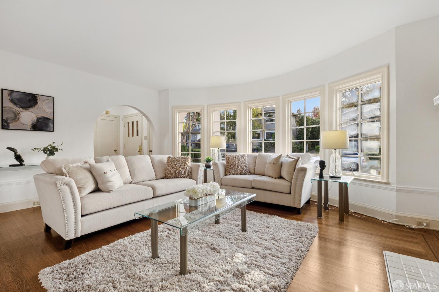 1316 Castillo Avenue Burlingame, CA 94010 - Photo 4 of 33 a living room with furniture and floor to ceiling windows