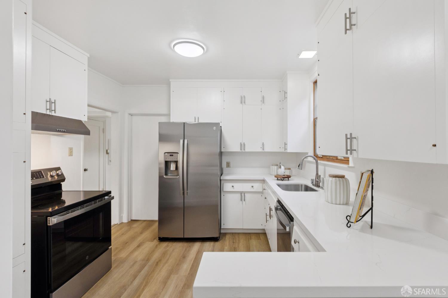 1316 Castillo Avenue Burlingame, CA 94010 - Photo 8 of 33 a kitchen with stainless steel appliances granite countertop a refrigerator a stove and a sink