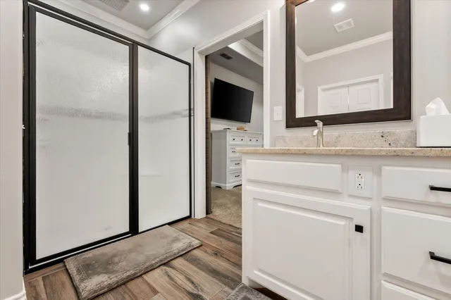 a spacious bedroom with a bed and a window