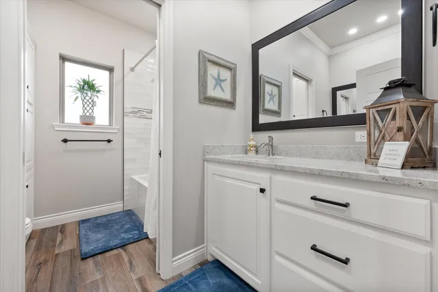 a bedroom with a bed and a desk