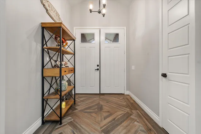a view of an entryway with wooden floor