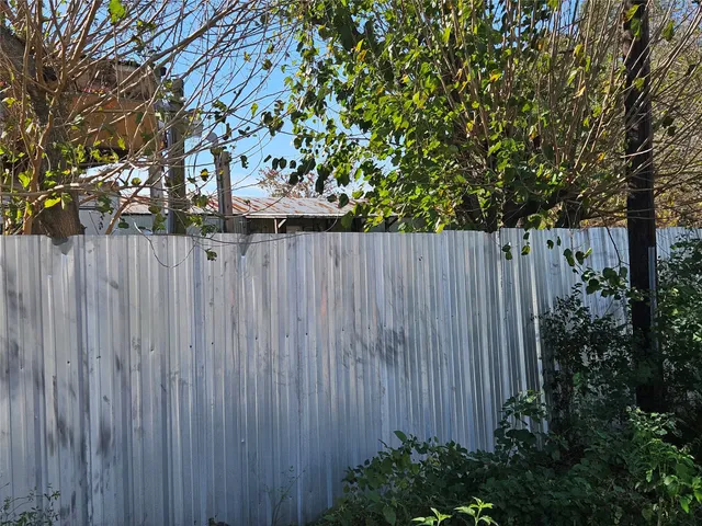 a view of a wooden fence