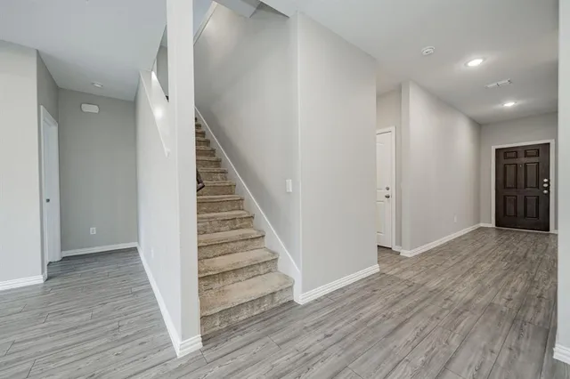 a view of entryway with wooden floor
