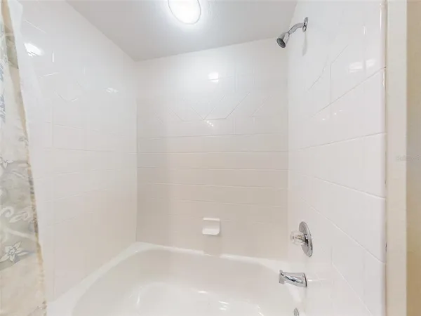 a dining room with furniture and view of kitchen