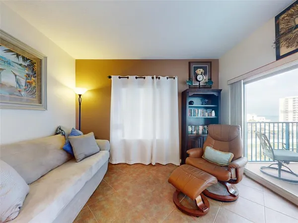 a spacious bedroom with a bed and a couch