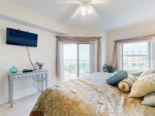 a bedroom with furniture and a window