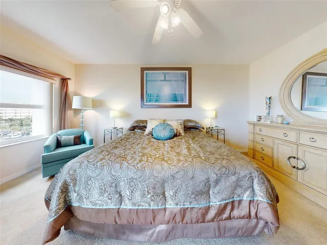 a bathroom with a sink mirror and toilet