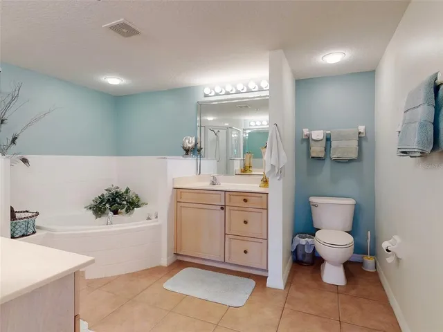 a bathroom with a shower sink and mirror