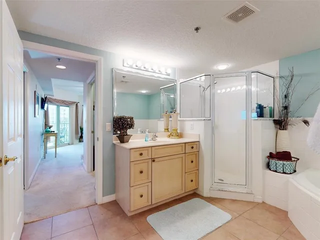 a balcony with furniture and a potted plant