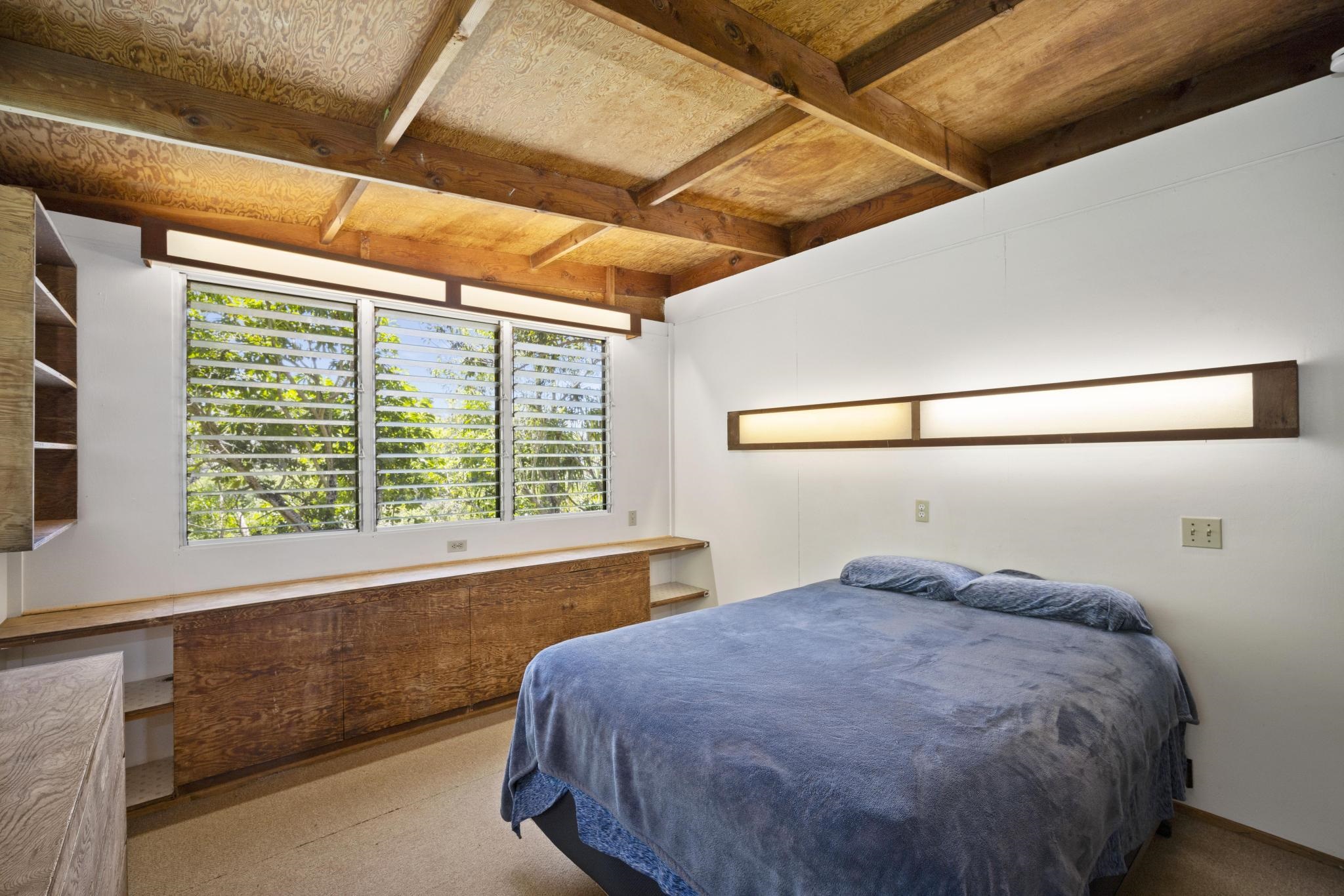 100 East Kuiaha Road Haiku, HI 96708 - Photo 12 of 31 a bedroom with a bed and window