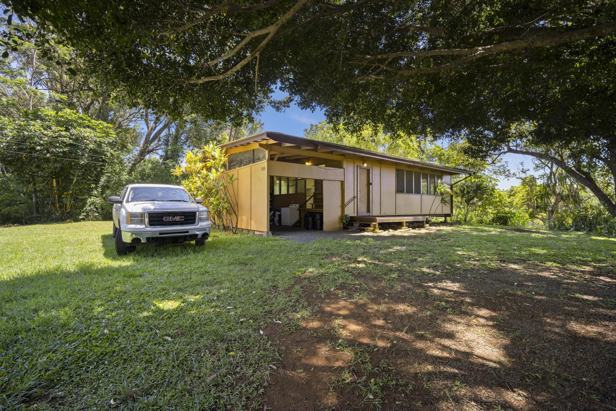 100 East Kuiaha Road Haiku, HI 96708 - Photo 16 of 31 a front view of a house with a garden