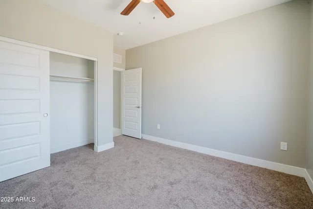 a bathroom with a granite countertop sink a mirror and a shower