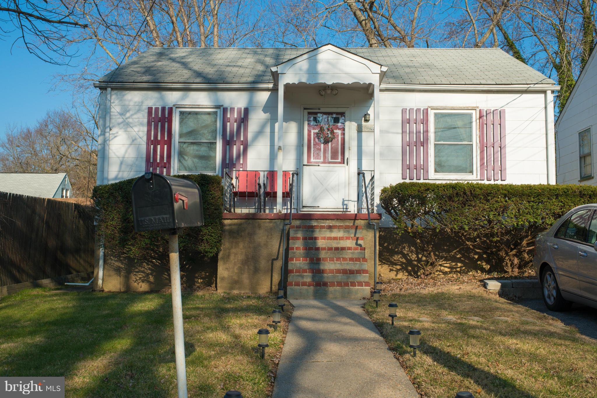 5314 Overhill Road Baltimore, MD 21207 - Photo 1 of 14 a front view of a house with a yard