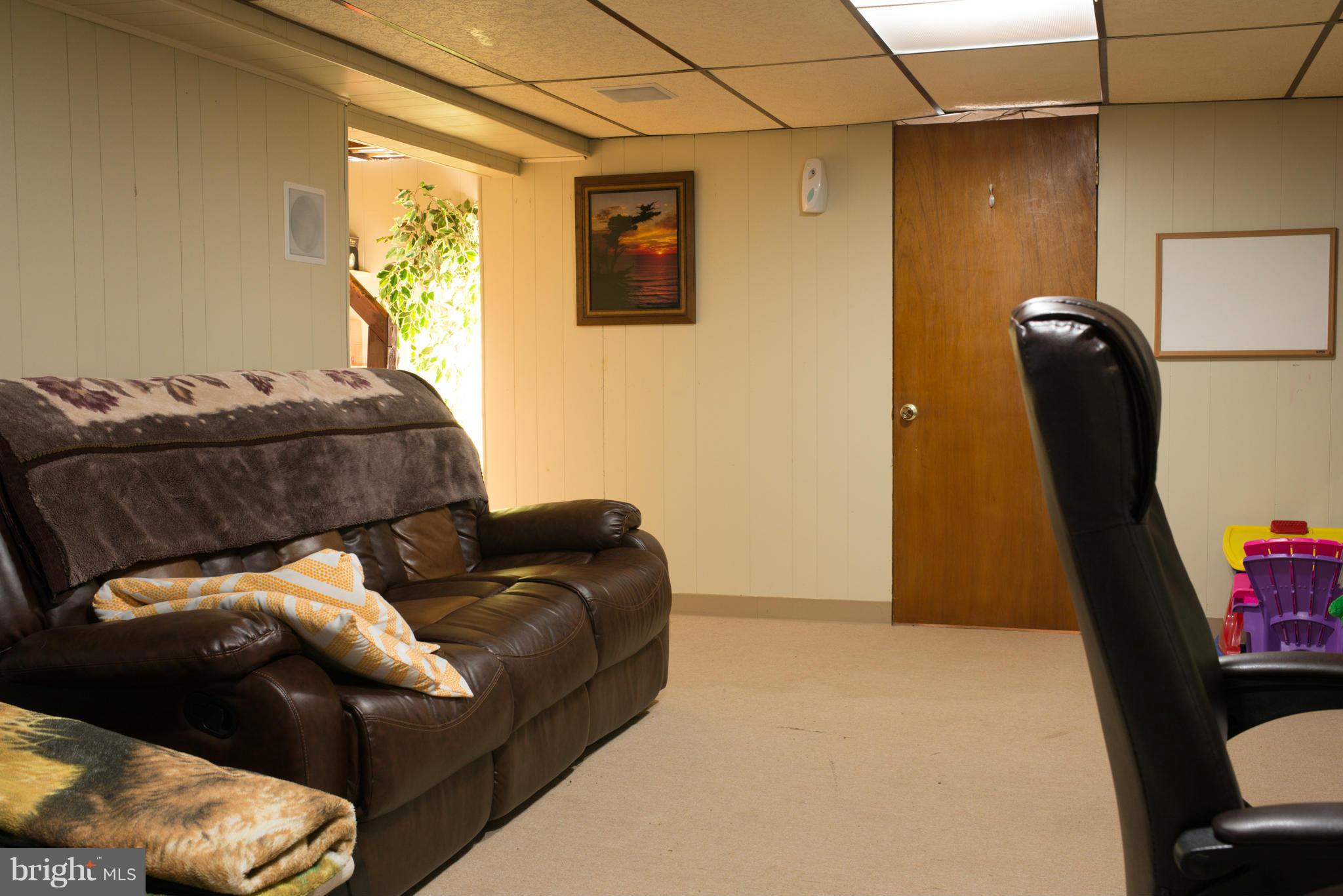 5314 Overhill Road Baltimore, MD 21207 - Photo 12 of 14 a living room with furniture and a couch