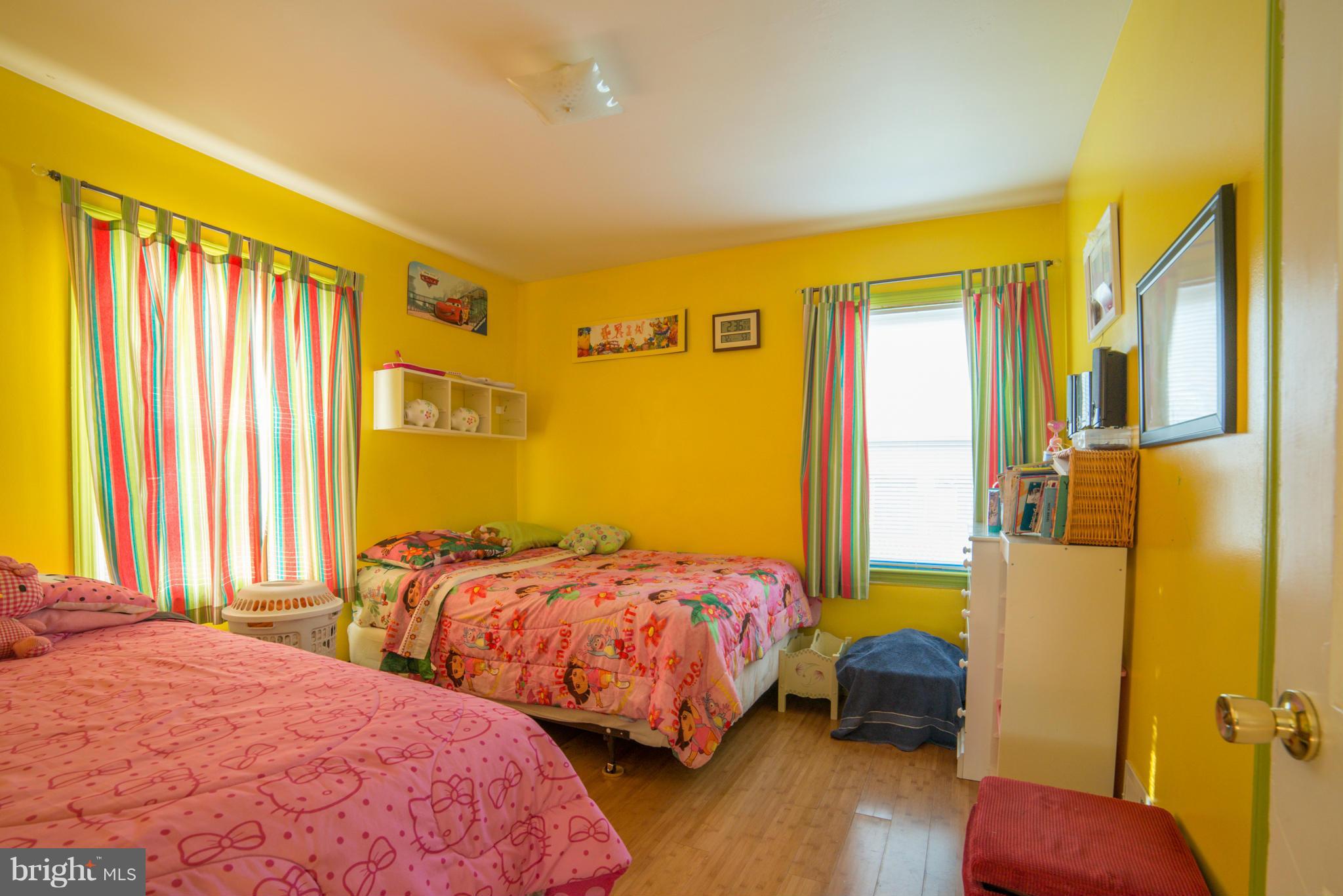5314 Overhill Road Baltimore, MD 21207 - Photo 14 of 14 a bedroom with two beds and wooden floor
