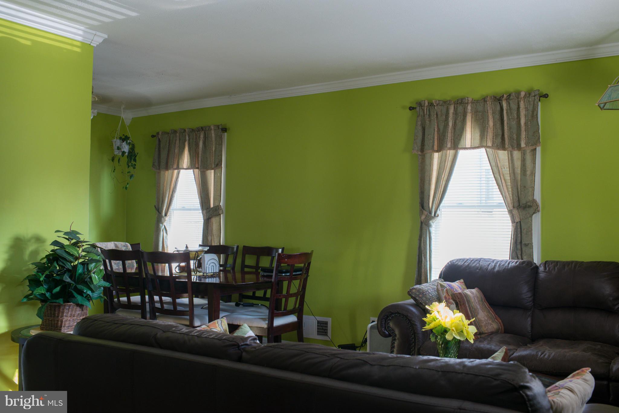 5314 Overhill Road Baltimore, MD 21207 - Photo 5 of 14 a living room with furniture and a large window