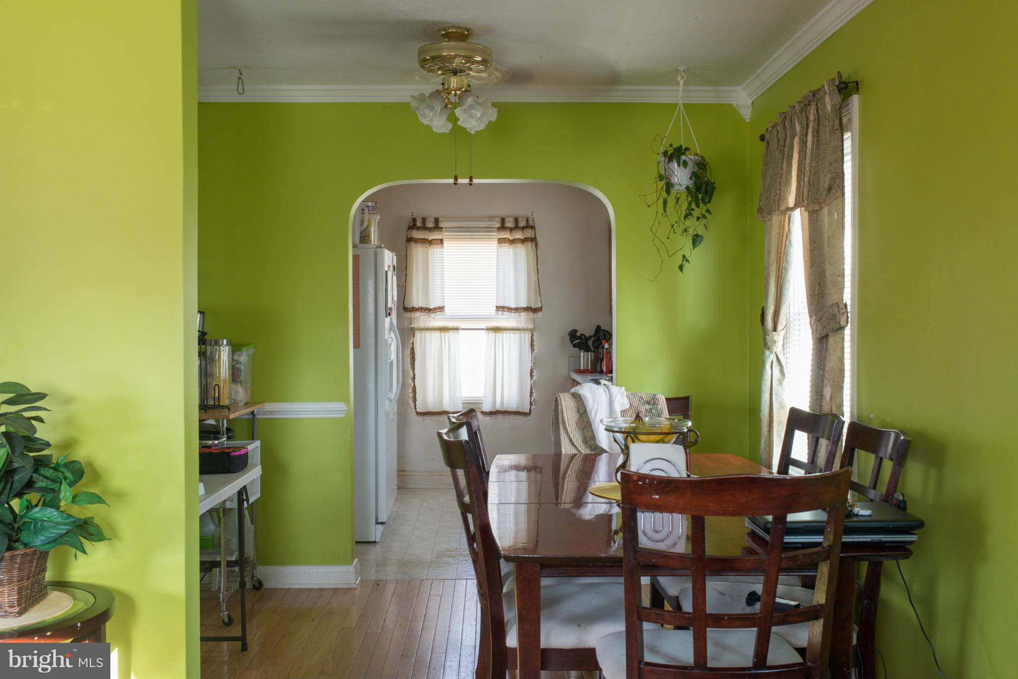 5314 Overhill Road Baltimore, MD 21207 - Photo 7 of 14 a dining room with furniture and window