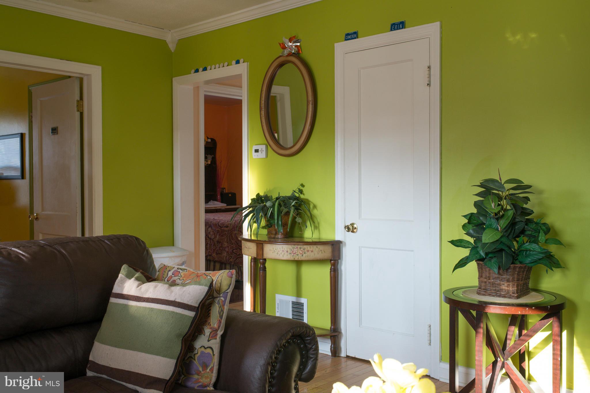 5314 Overhill Road Baltimore, MD 21207 - Photo 8 of 14 a living room with furniture and a potted plant