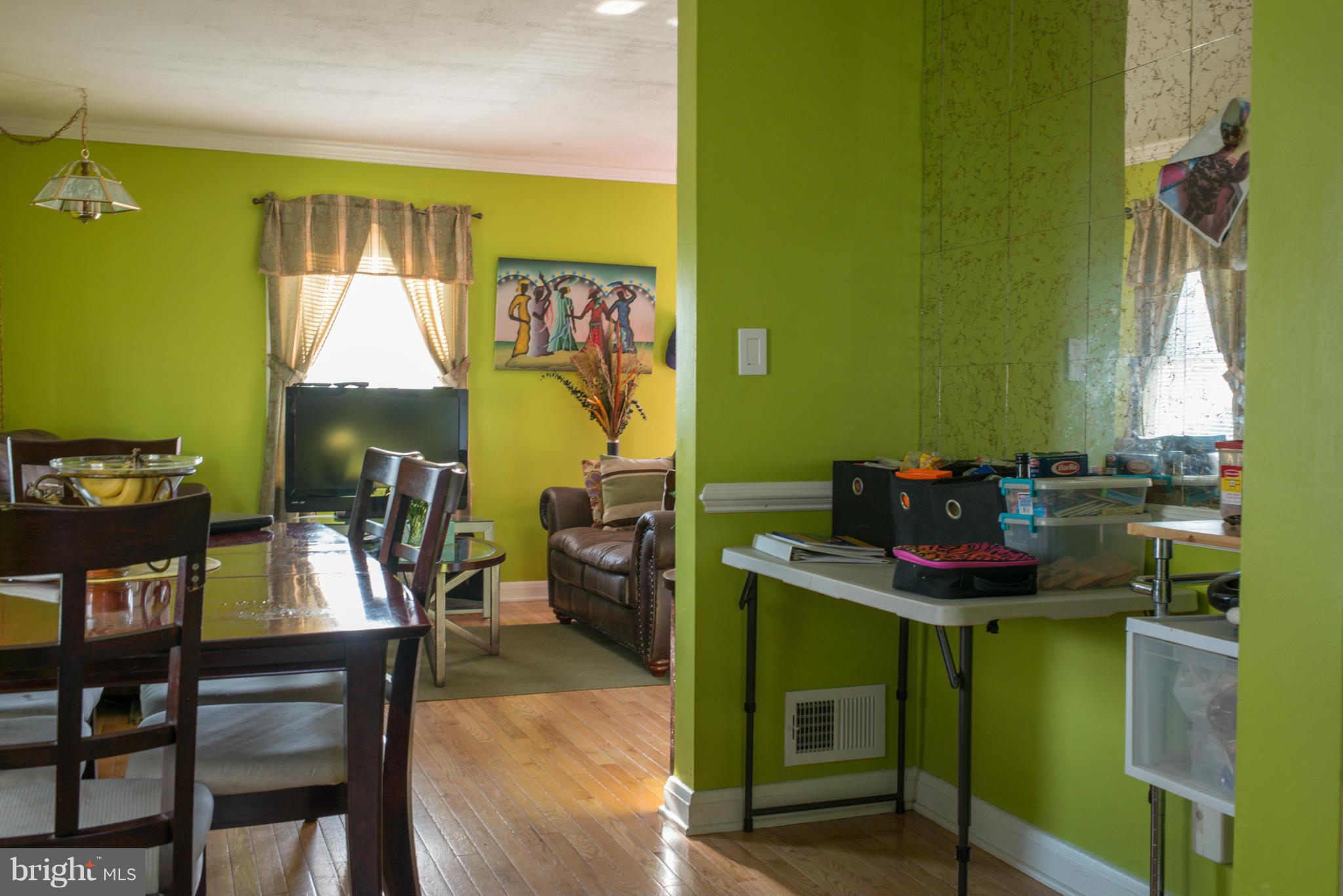 5314 Overhill Road Baltimore, MD 21207 - Photo 10 of 14 a dining room with furniture and a window