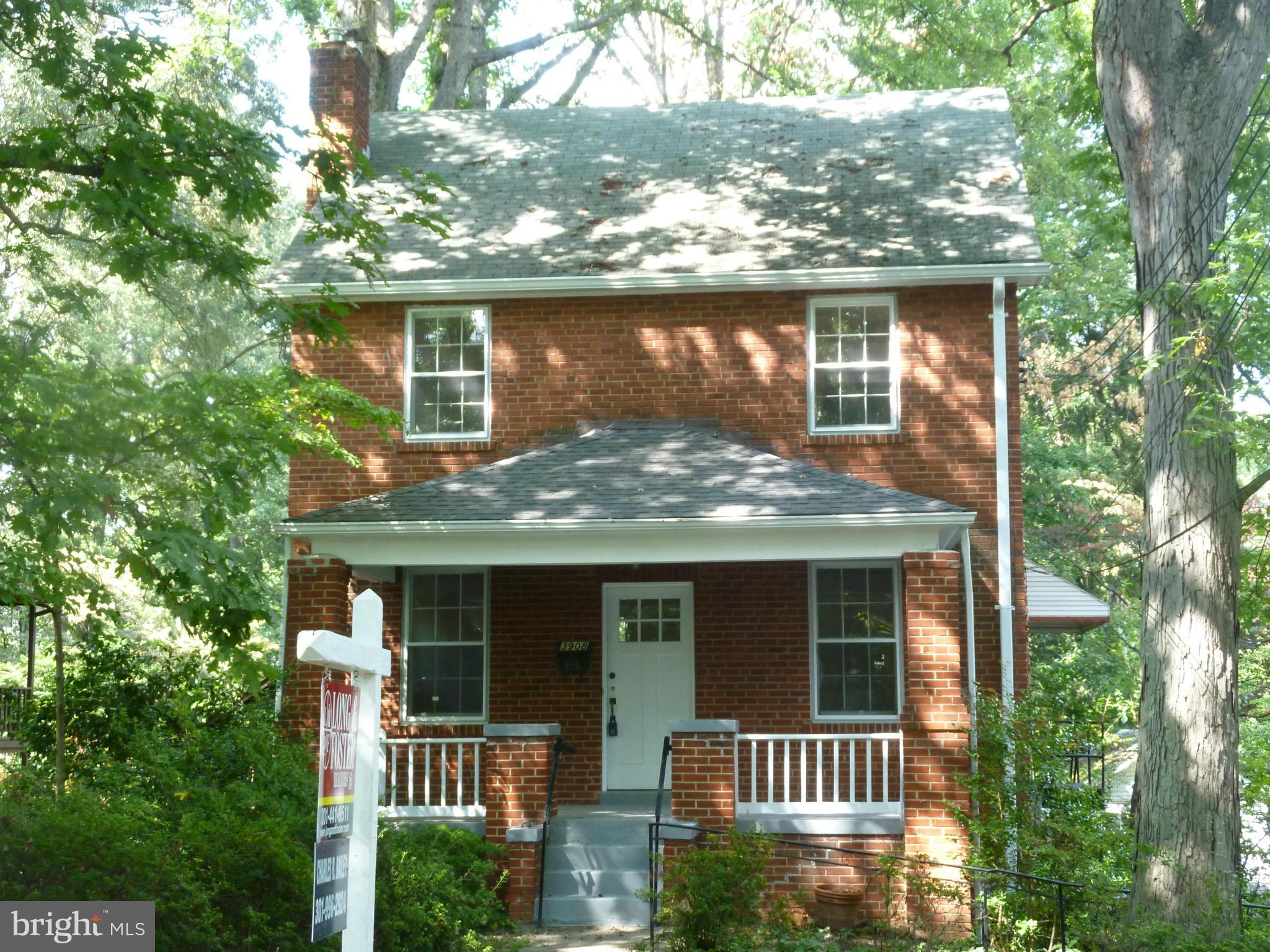 front view of house with a tree