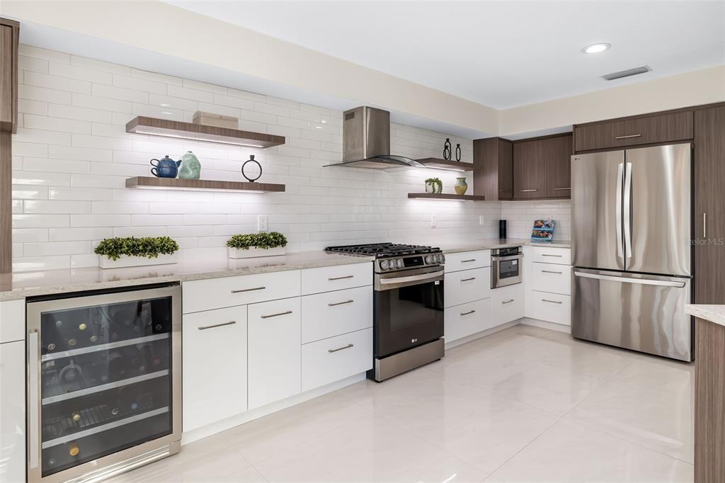 480 Cleveland Drive Sarasota, FL 34236 - Photo 14 of 95 a kitchen with stainless steel appliances white cabinets and a stove