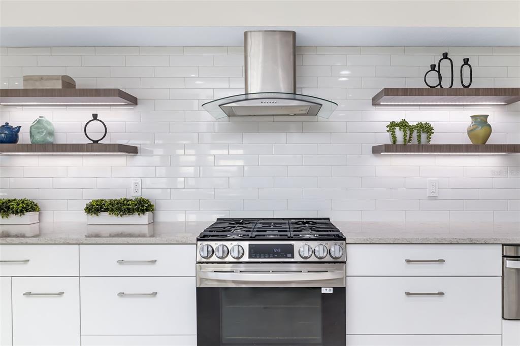 480 Cleveland Drive Sarasota, FL 34236 - Photo 17 of 95 a stove top oven sitting inside of a kitchen