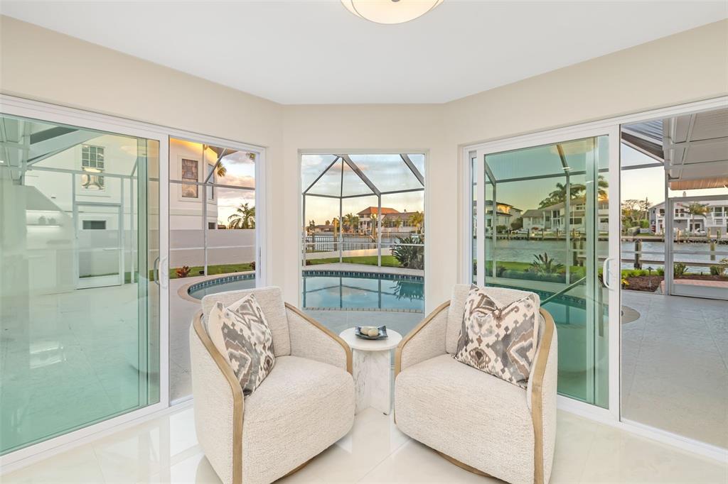 480 Cleveland Drive Sarasota, FL 34236 - Photo 21 of 95 a living room with furniture and a floor to ceiling window