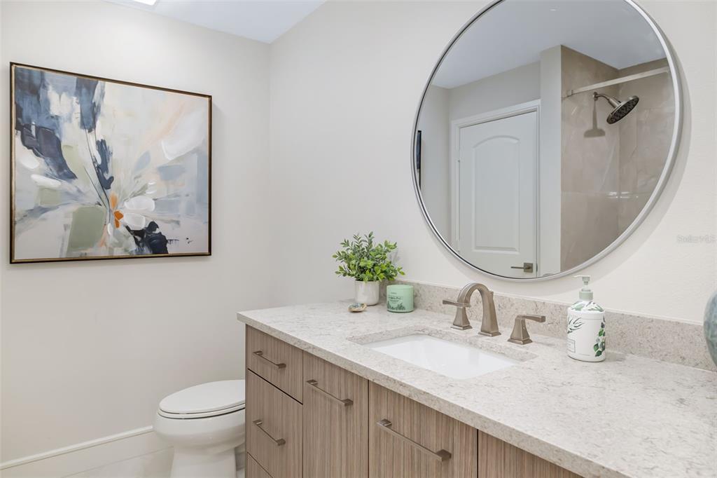 480 Cleveland Drive Sarasota, FL 34236 - Photo 40 of 95 a bathroom with a granite countertop sink mirror and toilet