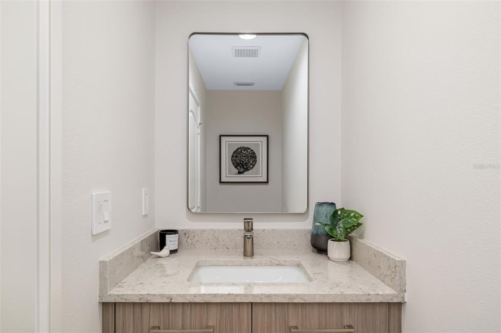 480 Cleveland Drive Sarasota, FL 34236 - Photo 45 of 95 a bathroom with a granite countertop sink and a mirror