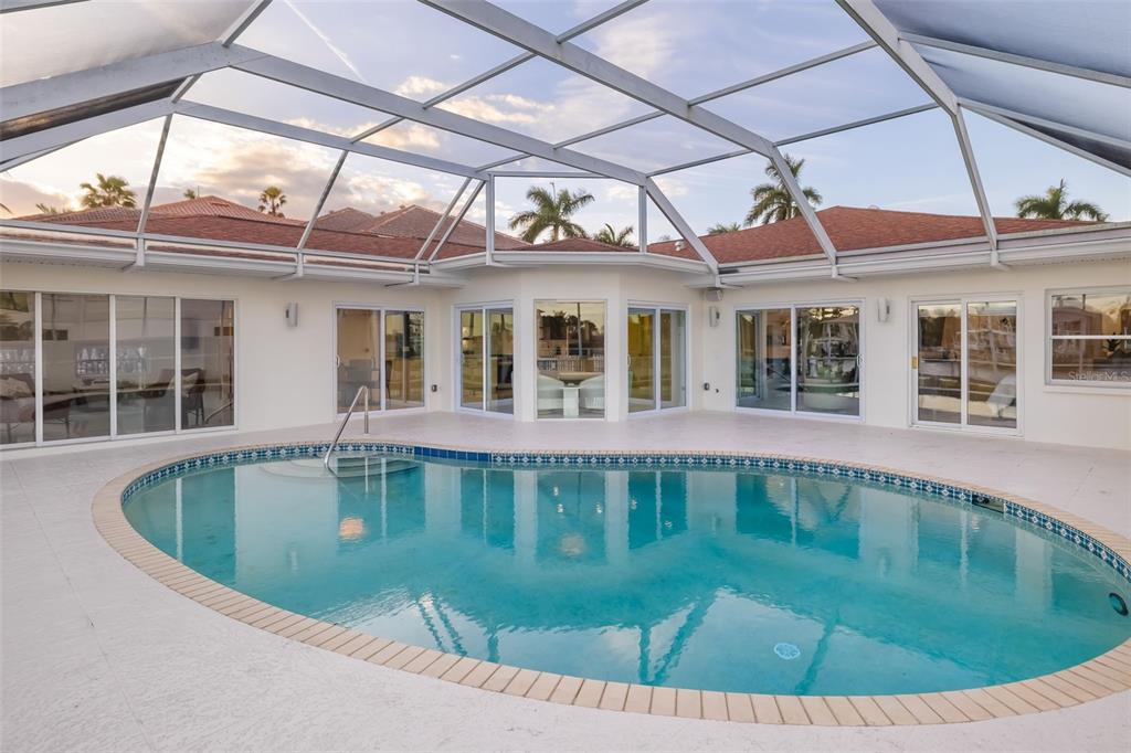 480 Cleveland Drive Sarasota, FL 34236 - Photo 51 of 95 a view of a white house with a swimming pool