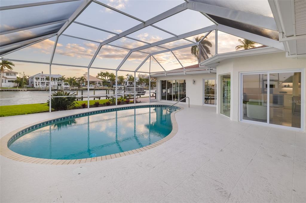 480 Cleveland Drive Sarasota, FL 34236 - Photo 52 of 95 a view of a swimming pool with a lounge chairs