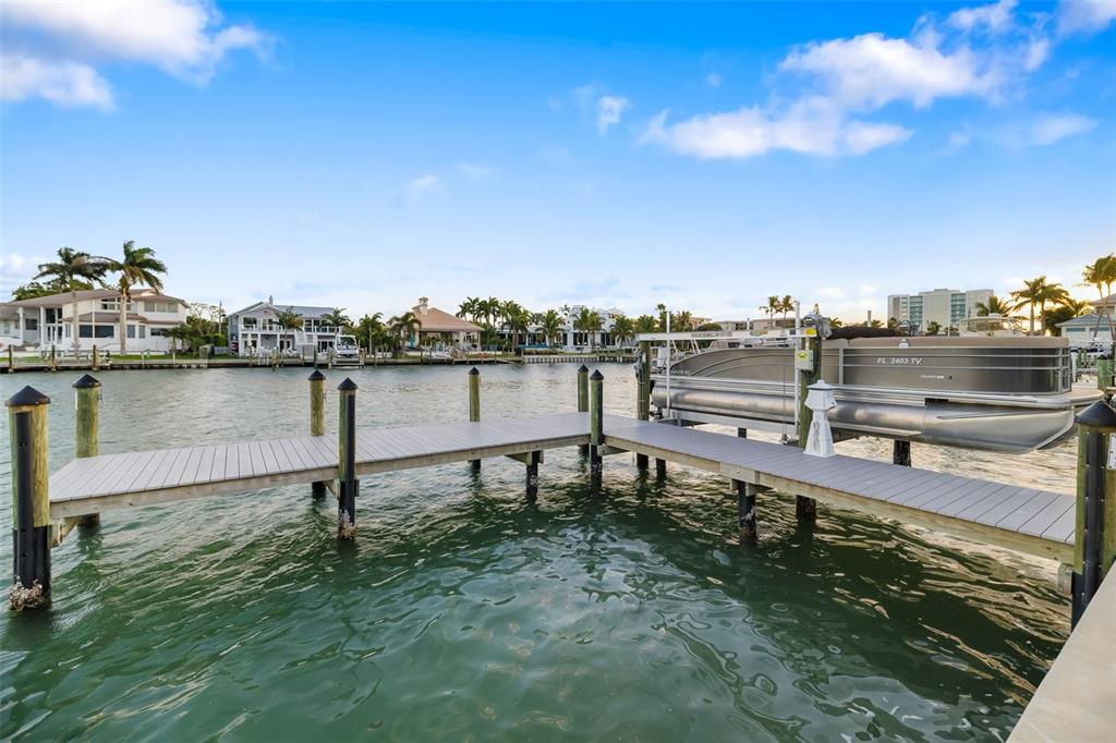 480 Cleveland Drive Sarasota, FL 34236 - Photo 58 of 95 a view of a lake with a table and chairs
