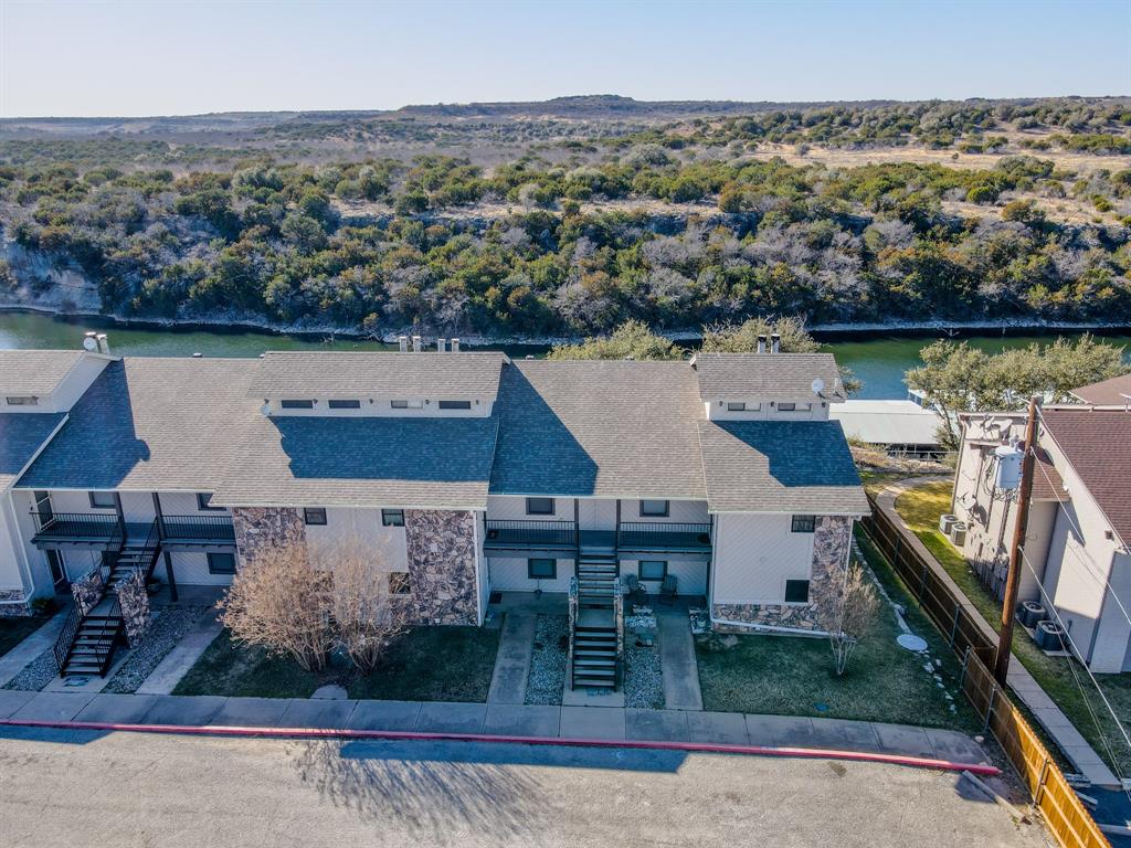 3037 Hells Gate Loop, Unit C208 Strawn, TX 76475 - Photo 9 of 24 an aerial view of multiple house
