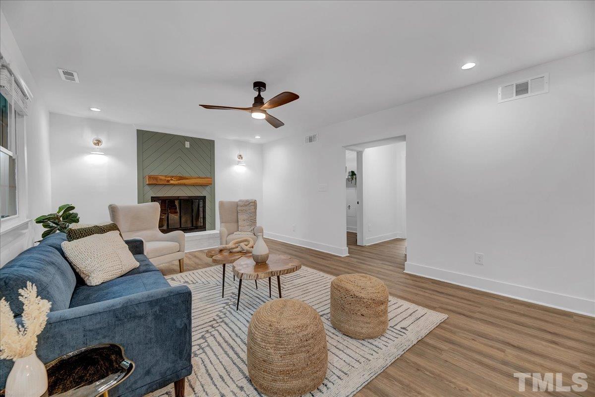 1108 East Millbrook Road Raleigh, NC 27609 - Photo 18 of 43 a living room with furniture and a wooden floor