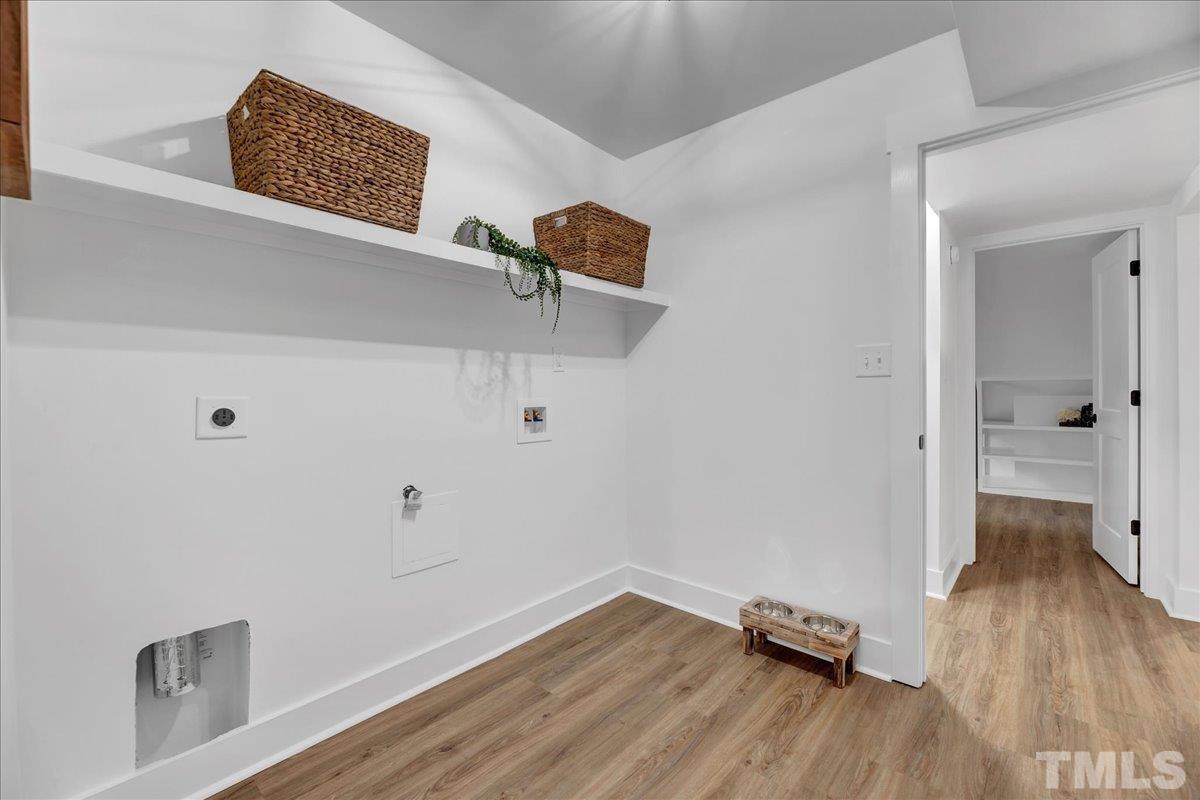 1108 East Millbrook Road Raleigh, NC 27609 - Photo 20 of 43 a view of a hallway with wooden floor