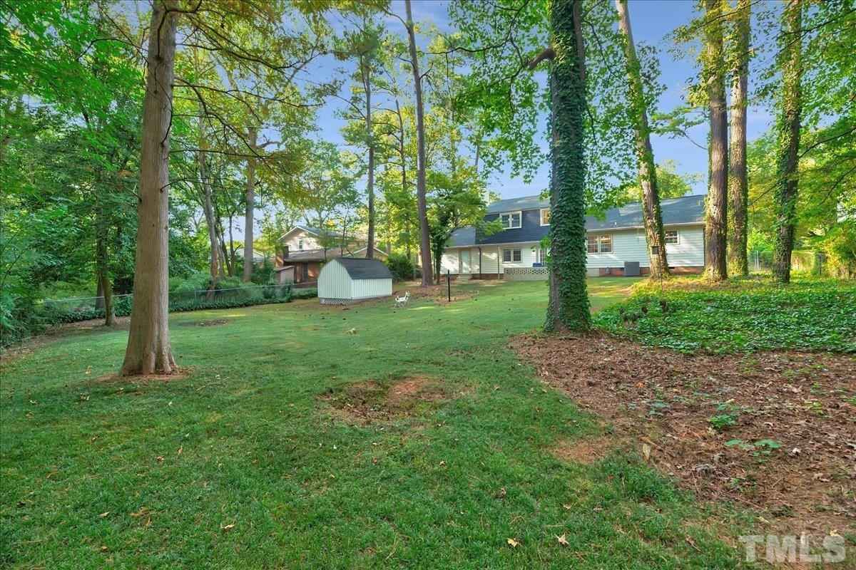 1108 East Millbrook Road Raleigh, NC 27609 - Photo 36 of 43 a view of a park with large trees