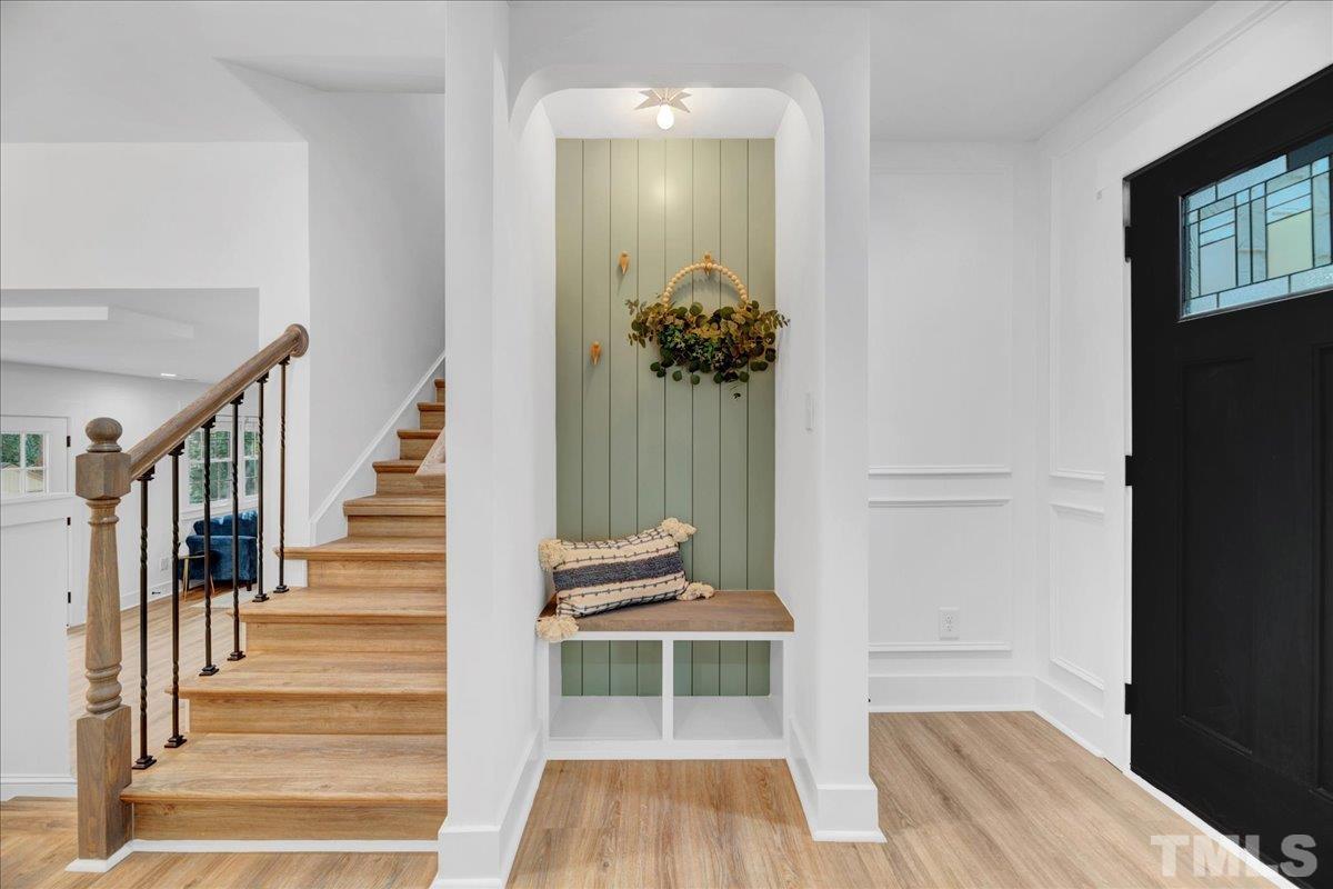 1108 East Millbrook Road Raleigh, NC 27609 - Photo 6 of 43 a view of entryway and hall with wooden floor