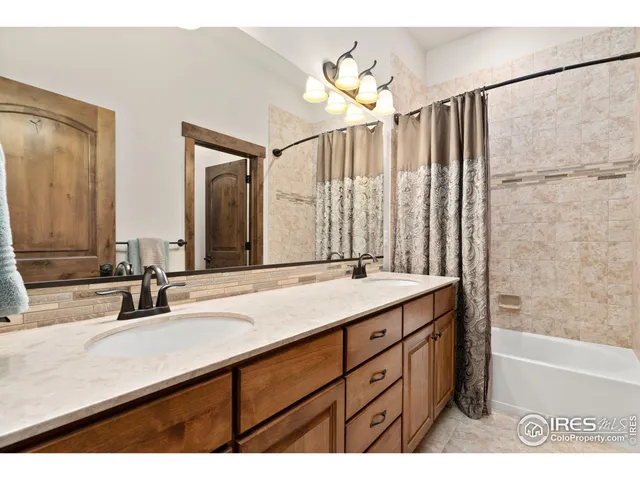 a bathroom with a double vanity sink mirror and double