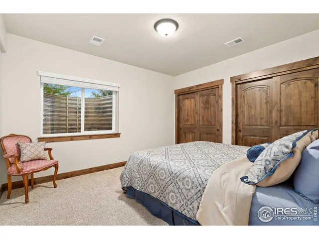 a bedroom with a bed and a couch