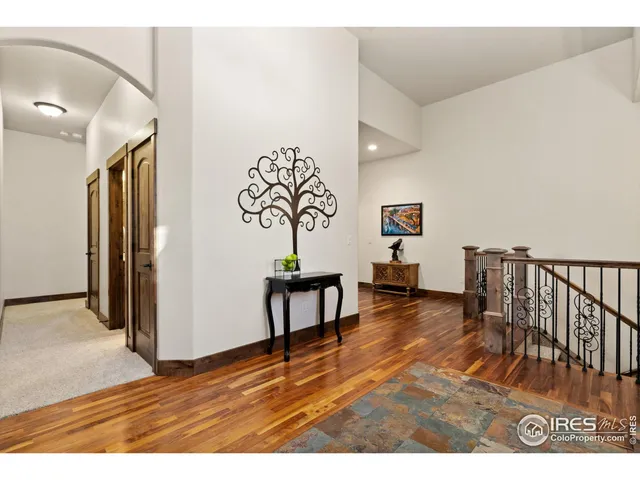 a view of entryway livingroom and hall with wooden floor